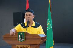 Sambutan  Kepala  SMP Negeri 1 Sampang yang diwakili oleh Wakil Kepala Sekolah, Suhardi S.P, di Auditorium Unas, 11 Desember 2023.